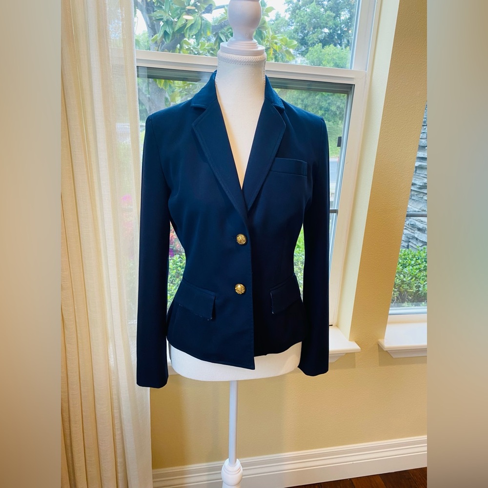 Navy blue blazer. Gold buttons accent. Size 0. Great condition.